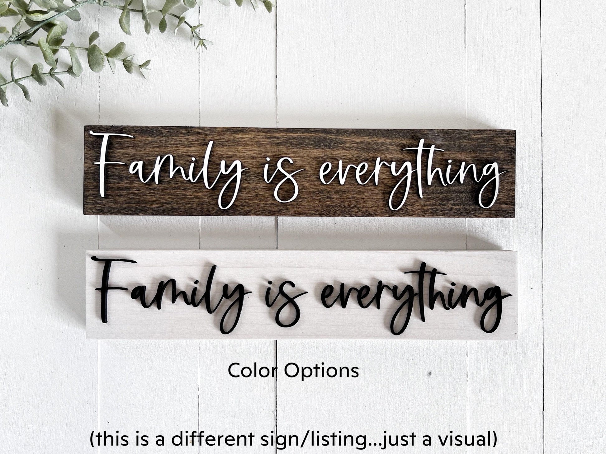 a wooden sign that says family is everything