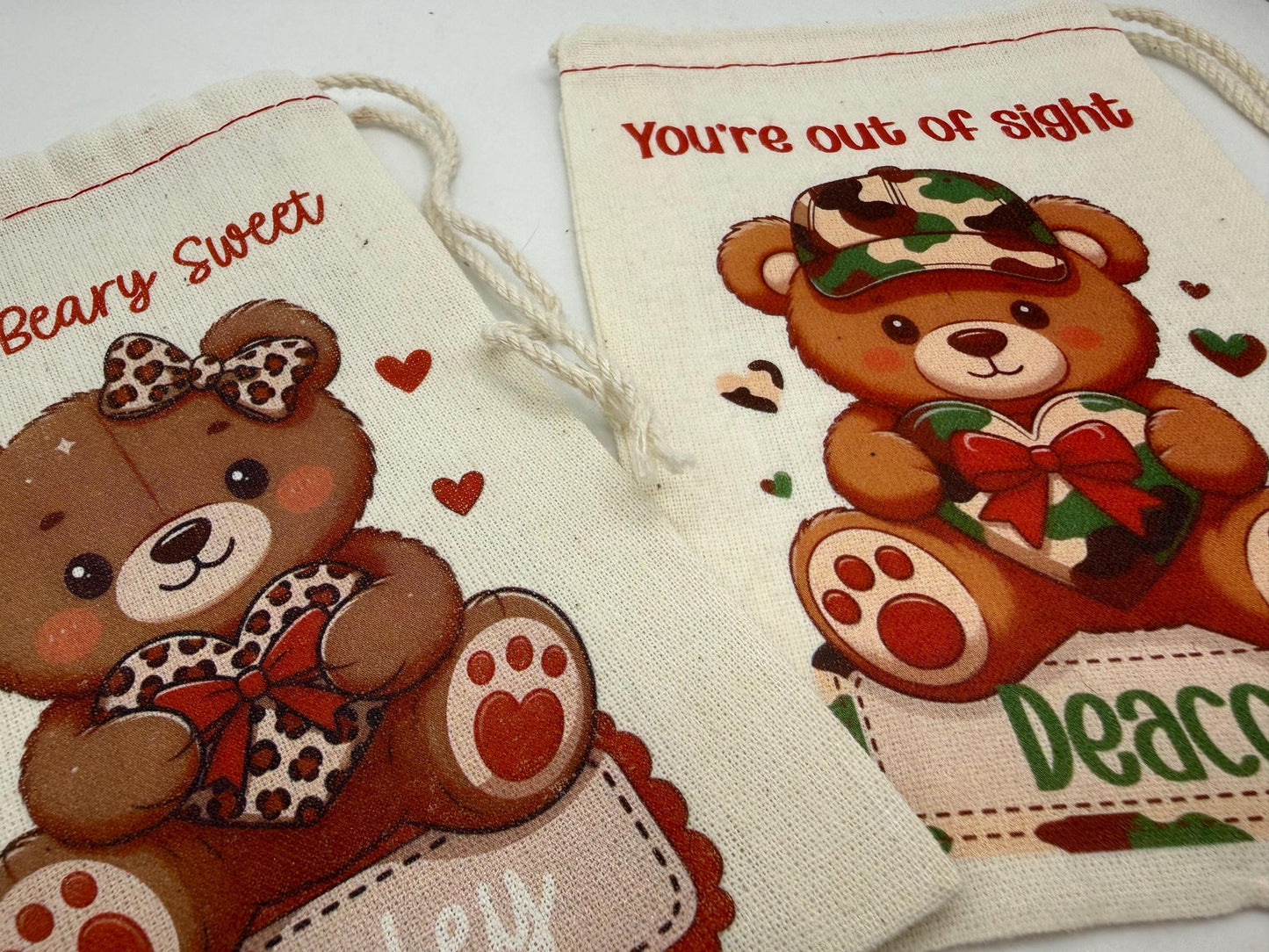 two teddy bear bags with illustrations of teddy bears and the text "You're out of sight" printed on them.