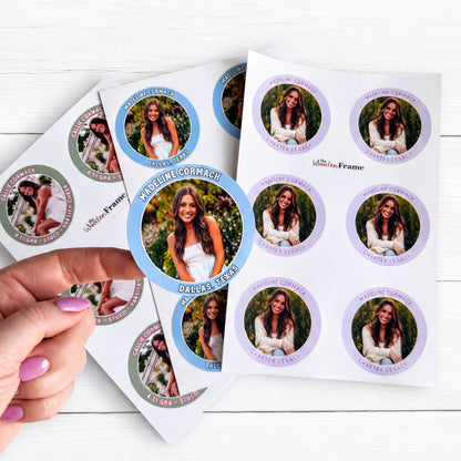 a hand holding a set of Stickers for sorority recruitment with a woman's photo on them.