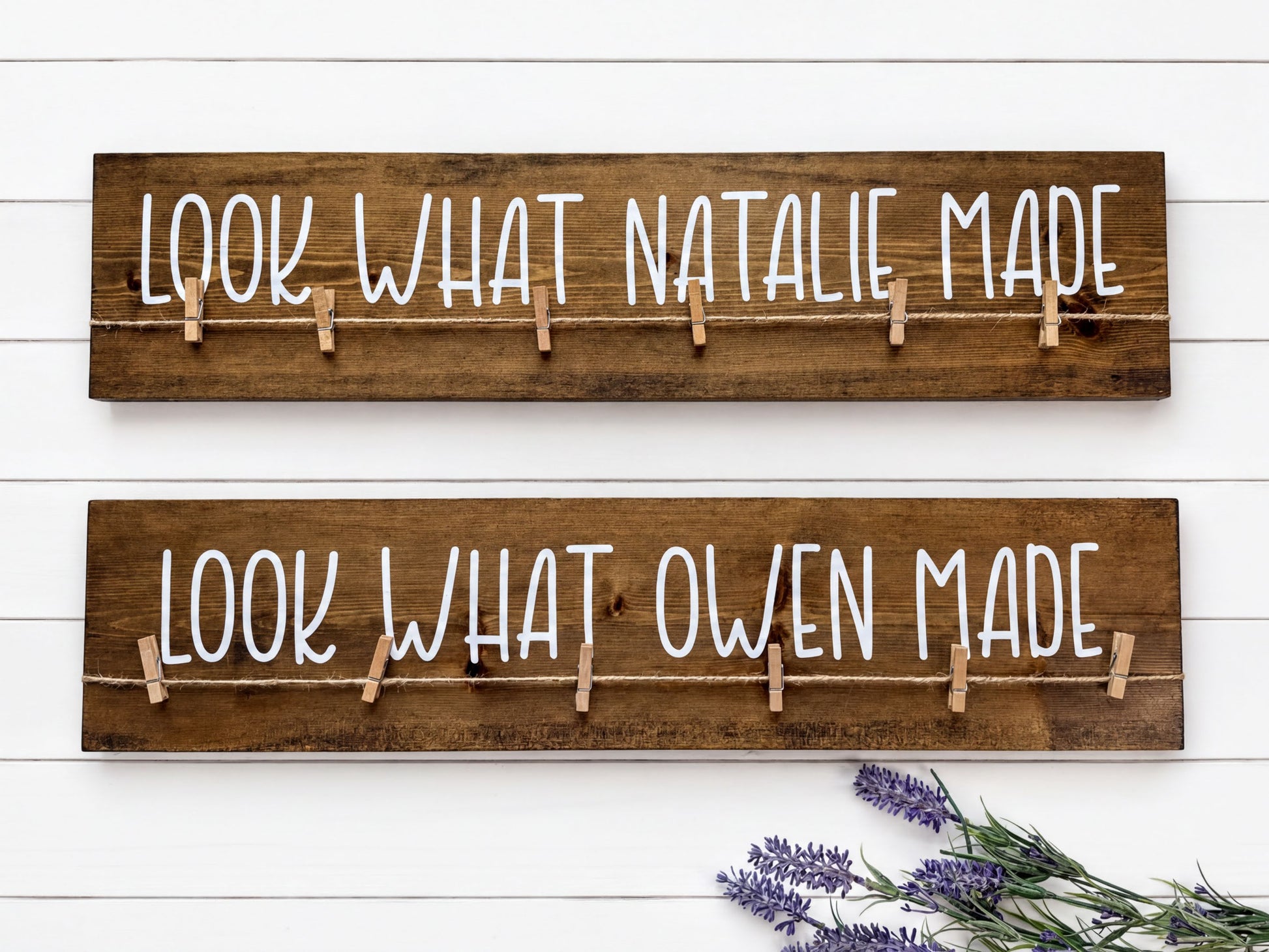 two wooden boards with the phrase "Look What Natalie Made" written on them, with clothespins attached to the boards.