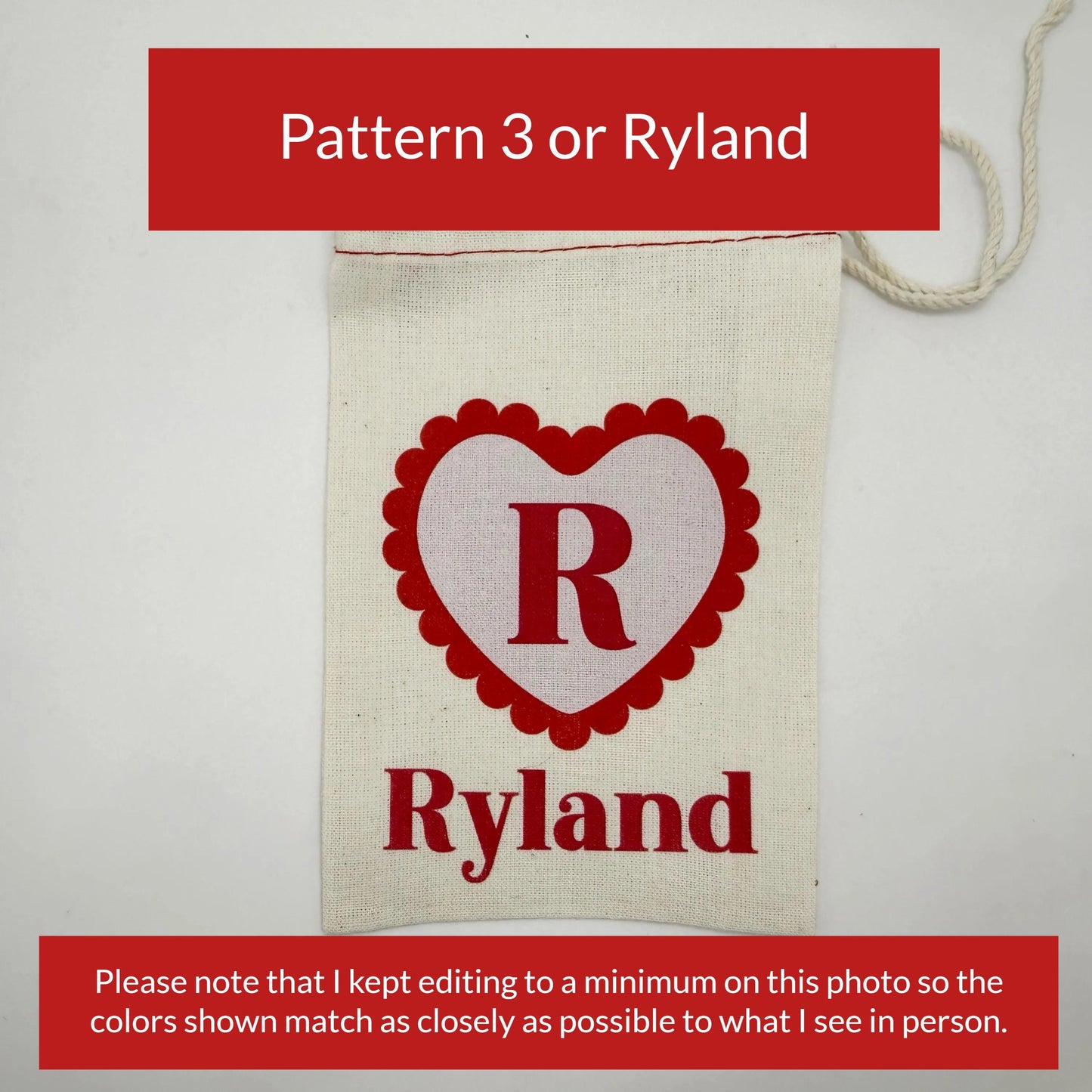 The image is a close-up of a beige fabric with a red heart-shaped logo and the name "Ryland" printed on it.