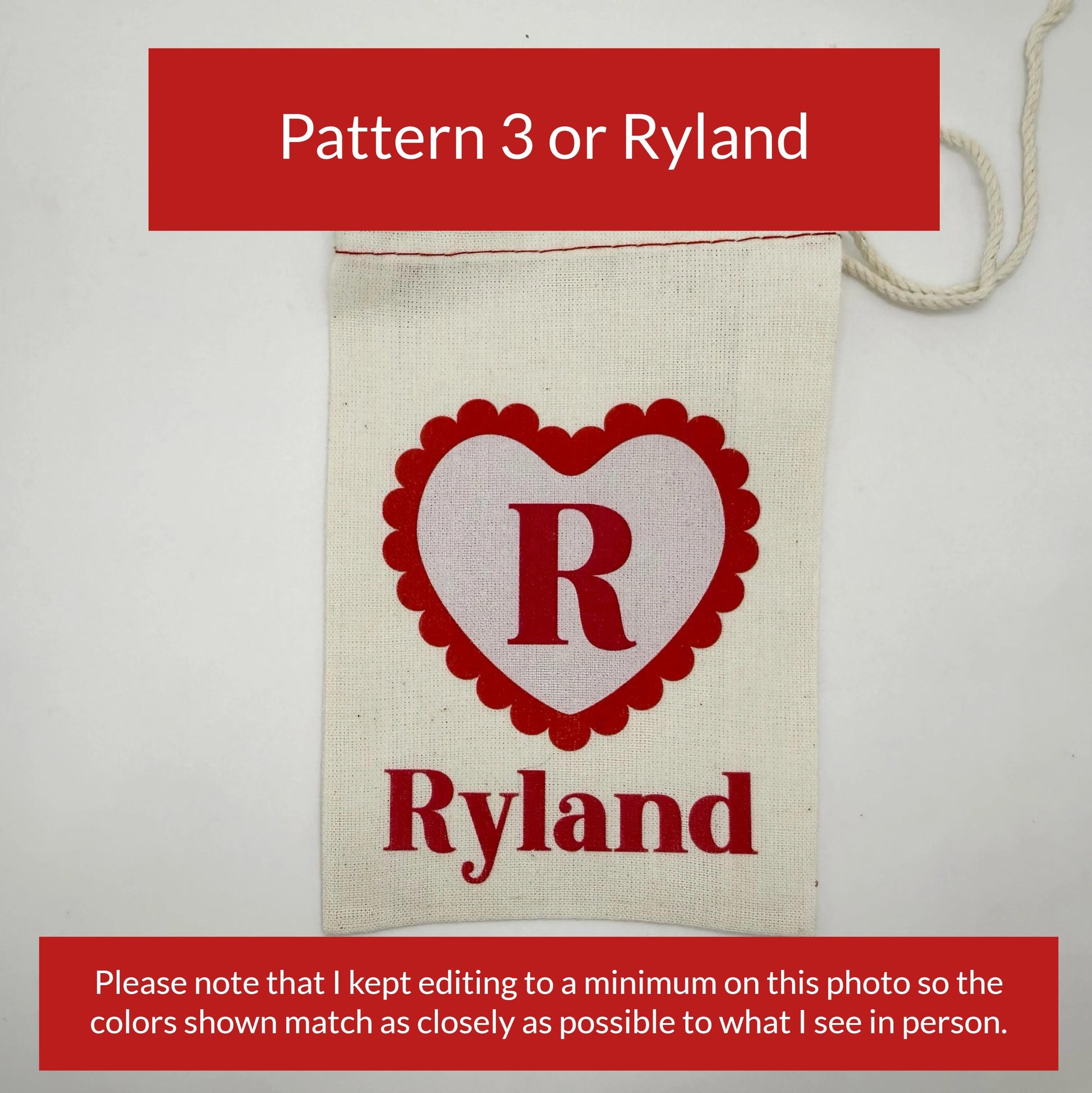 The image is a close-up of a beige fabric with a red heart-shaped logo and the name "Ryland" printed on it.