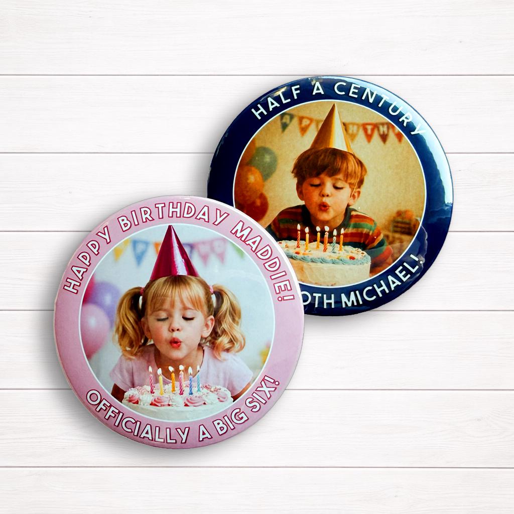 two birthday badges with a young girl blowing out candles on a cake and a young boy blowing out candles on a cake.