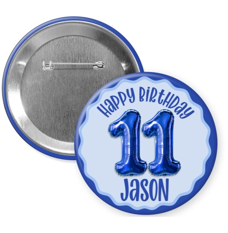 A round blue button with the text "Happy Birthday Jason 11" and a graphic of blue balloons representing the number 11.