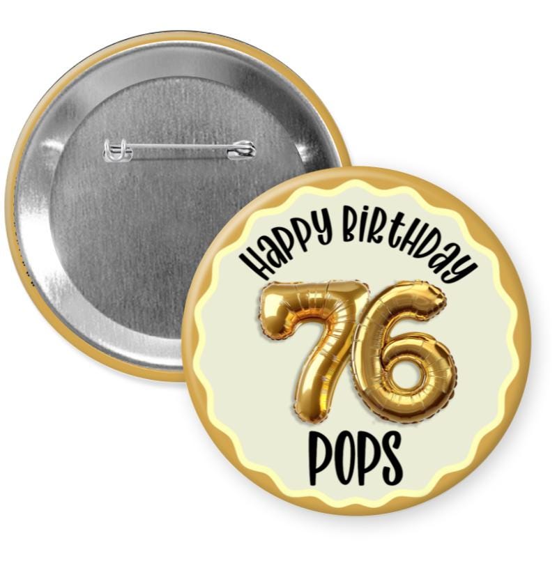 A round pin with a silver background and a gold border, featuring the number 76 and the text "Happy Birthday 76 POPS" on it.